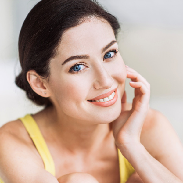 young woman with blue eyes smiling